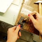 Laura Baroni brushes glue on leather straps. Photo by Salvo Sportato