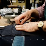 A more experienced tailor stitches a suit by hand. Photo by Salvo Sportato