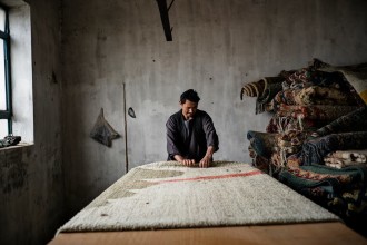 A carpet weaver in Afghanistan.  Ishkar courtesy photo