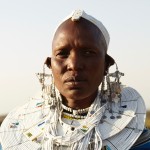 A Maasai tribeswoman is adorned in traditional jewellery now available worldwide by the Alama project. Photo by Sarah Staiger