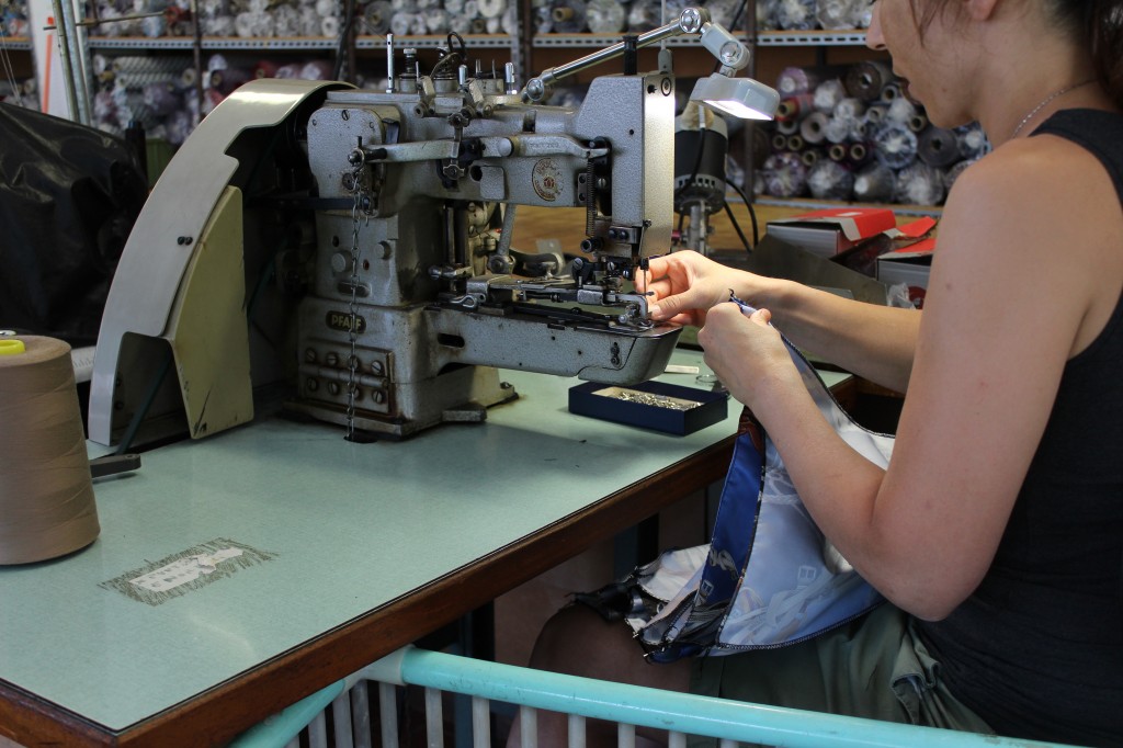 After the fabrics are cut in triangles, they are stitched together until the canopy of the umbrella is formed.